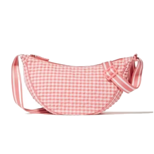 Pinkki-valko-ruutuinen olkalaukku. Pinkki on näkyvämpi väri